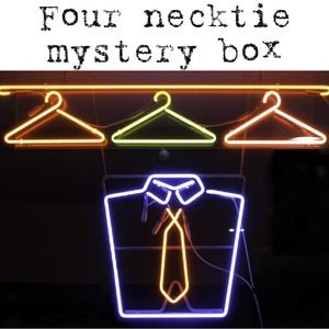 Mystery box containing four men’s neckties - variety of prints - no solid colors